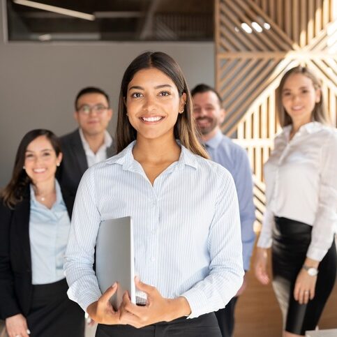 Confident hispanic business woman in office